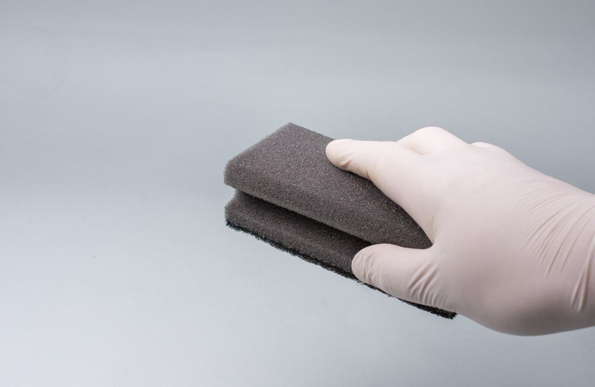 hand holding sponge hand holding sponge